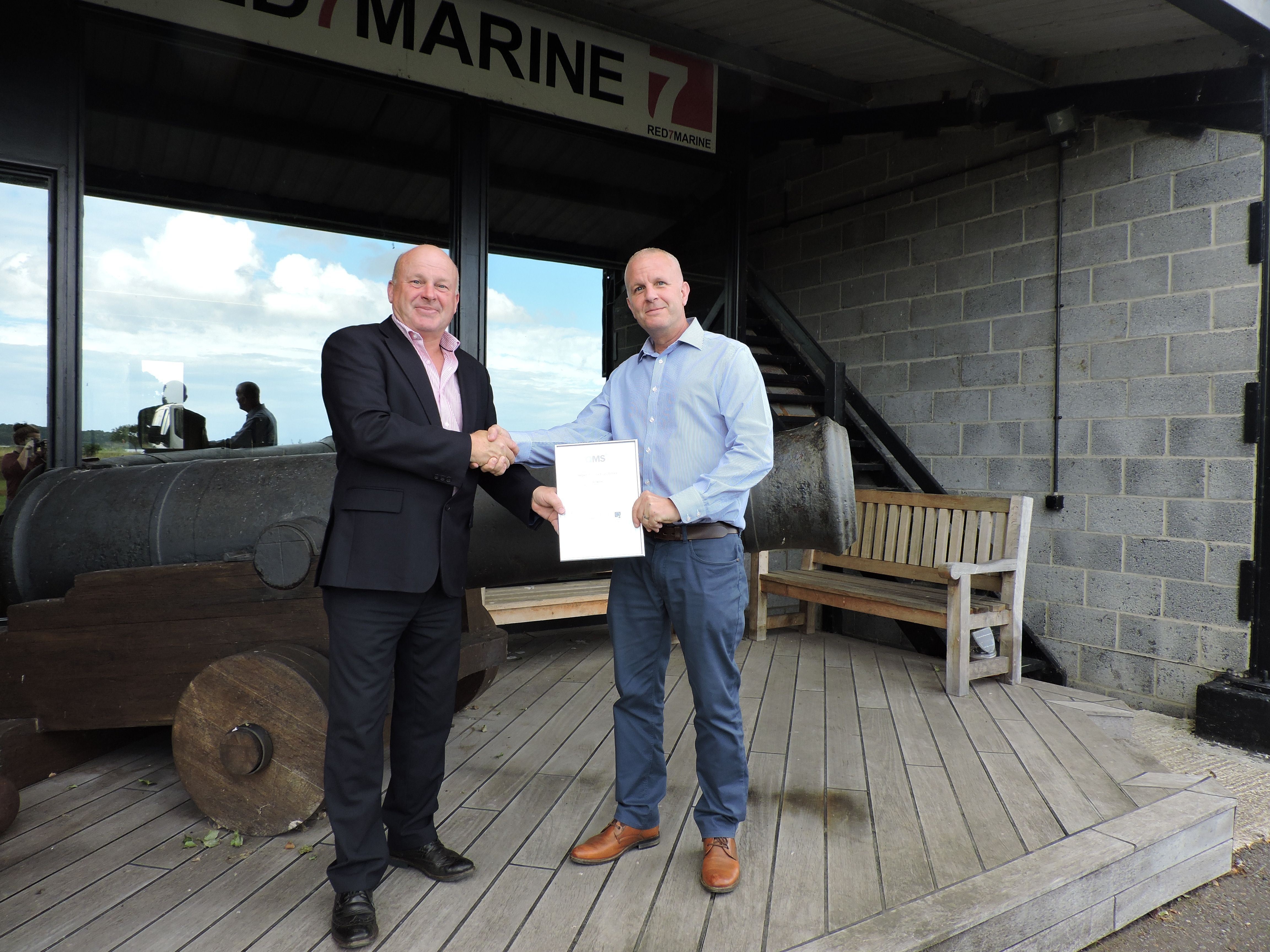 Mark Smith (QMS Manager) presenting Nick Offord (Managing Director) with the OHSAS 18001: 2007 accreditation certificate.